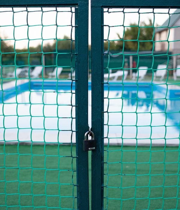 A closed gate at the entrance to the pool